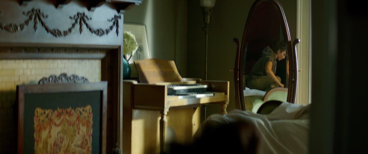 A moody interior with warm window light
